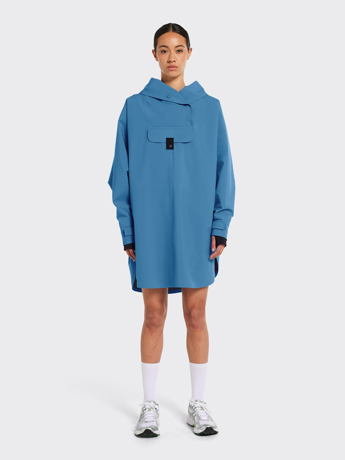 Model wearing Bergen poncho by Blæst in the color Coronet Blue