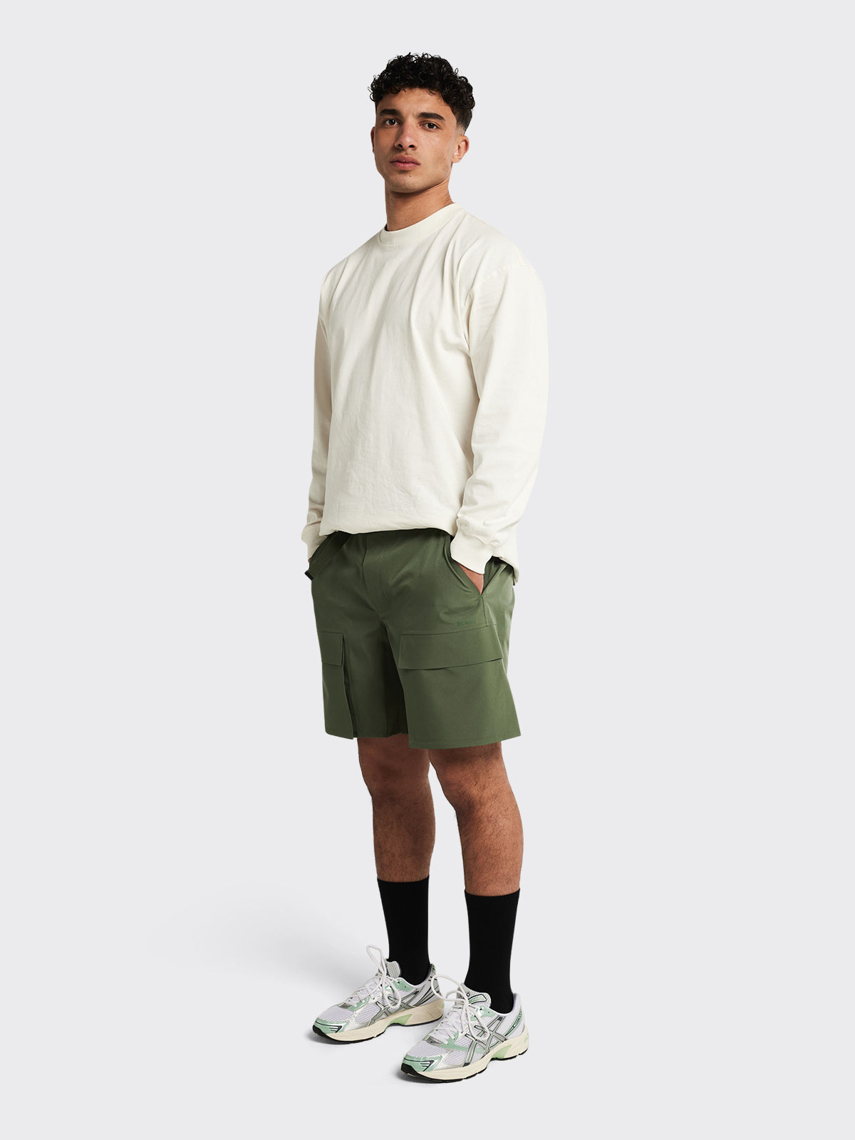 Man wearing Giske shorts by Blæst in Dusty Green